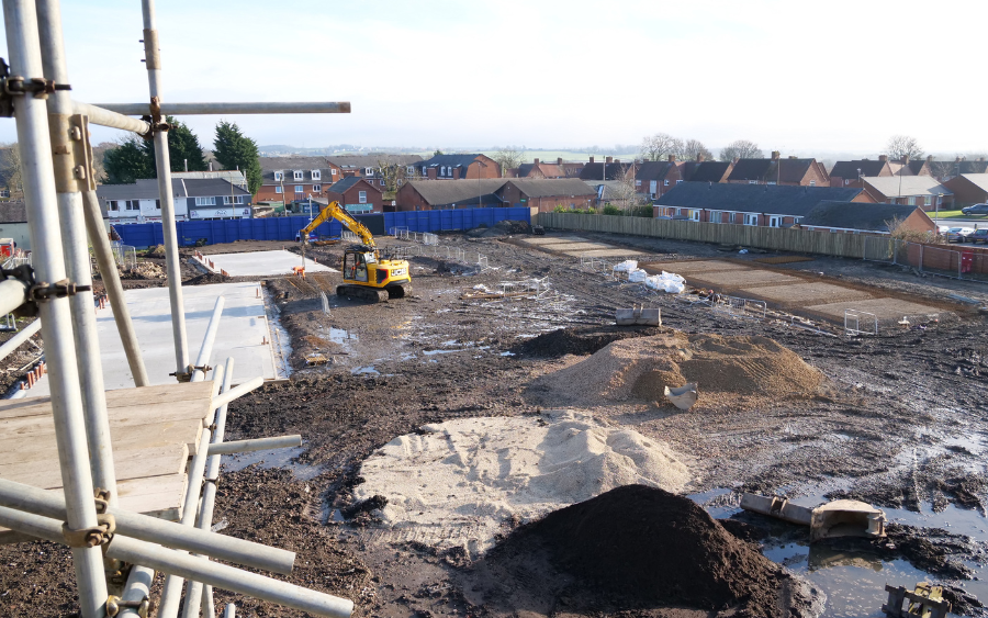 Wide shot of Baileys Square construction site focusing on business unit foundations